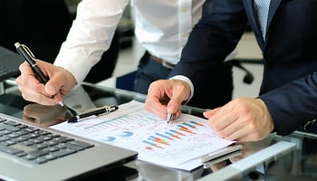 A business owner reviewing loan options with a financial advisor.