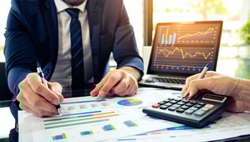 A business owner reviewing loan options with a financial advisor.