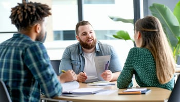  A team meeting to discuss loan terms and application readiness.