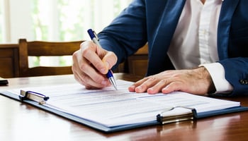 Borrower reviewing loan agreement details before signing.