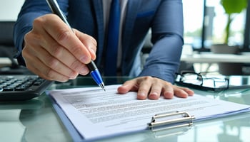 Business owner discovering hidden fees in an equipment lease contrac