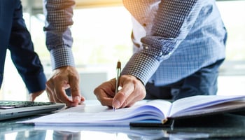 Business owner reviewing equipment lease terms and definitions