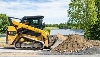 Contractor using a financed skid steer on a job site