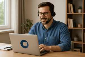 Employee working remotely with company-financed laptop and headset