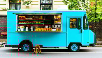 Food truck owner reviewing financing paperwork with a lender