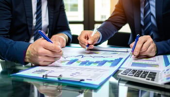 Project managers and translators planning service expansion using business loan