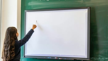 Smart board being installed in private school classroom funded by loan