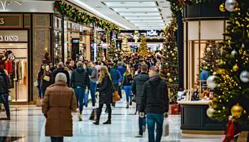 The image depicts a bustling retail environment during the holiday season. 