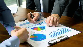 A financial advisor helping a business owner with a plan to improve their credit score.