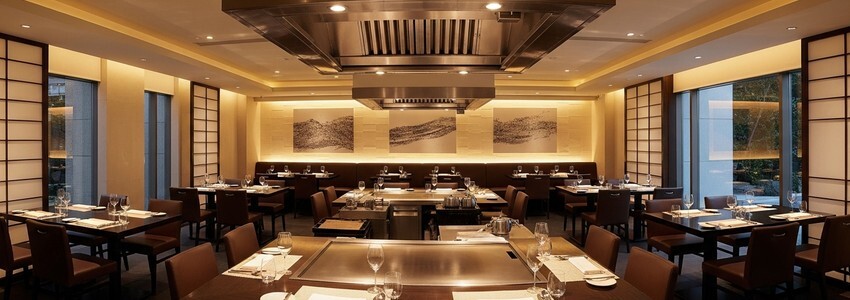 Hibachi restaurant dining room with teppanyaki grill station