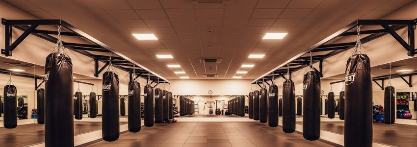 Kickboxing gym interior with heavy bags and professional training equipment