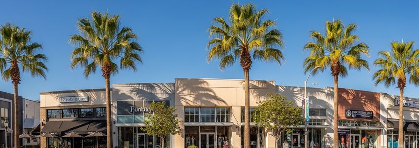 Small business district in Moreno Valley California with palm trees and commercial storefronts