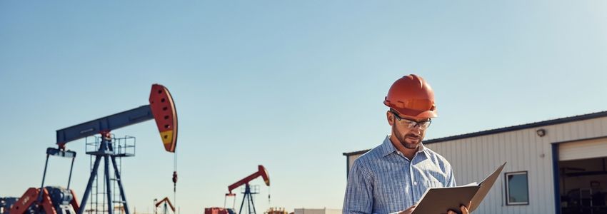 Small business loans in Odessa Texas - oil industry professional reviewing documents