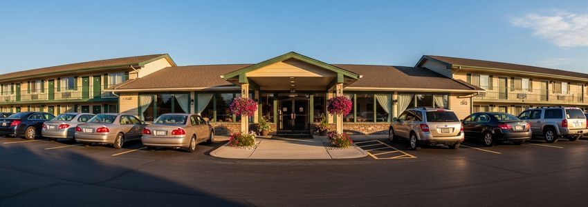 Well-maintained motel exterior with parking lot, representing motel business loans for hospitality owners