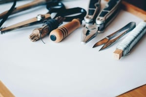 Pens and paper arranged neatly on a desk, representing planning, organization, and business documentation