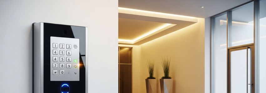 Modern access control keypad mounted on a commercial office wall