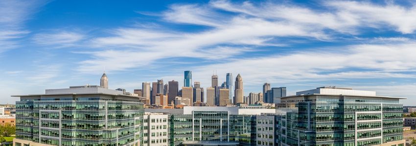 Commercial real estate office buildings and city skyline representing balloon mortgage lending in commercial real estate