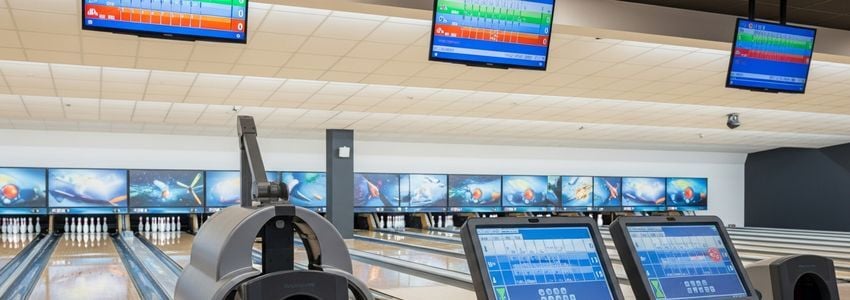 Commercial bowling lane equipment including automated pinsetters and scoring systems in a modern bowling center