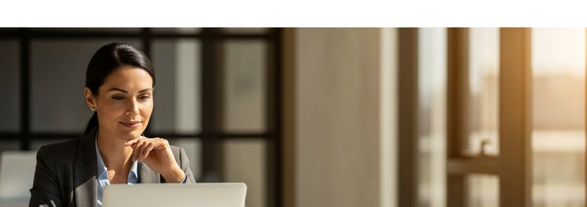 Business professional reviewing loan pre-approval documents at desk