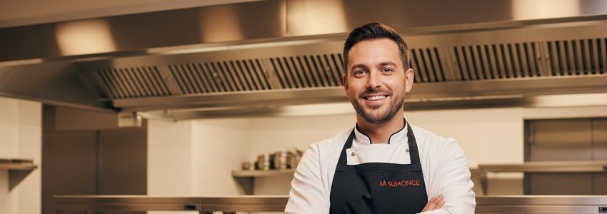 Small business owner reviewing financial growth charts after equipment leasing helped expand operations