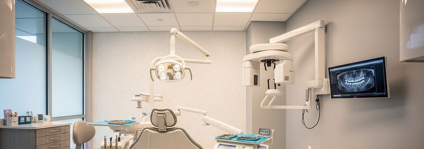 Dentist reviewing practice financing documents in a modern dental operatory