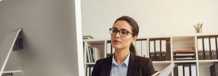 Document management professionals reviewing documents in a modern office