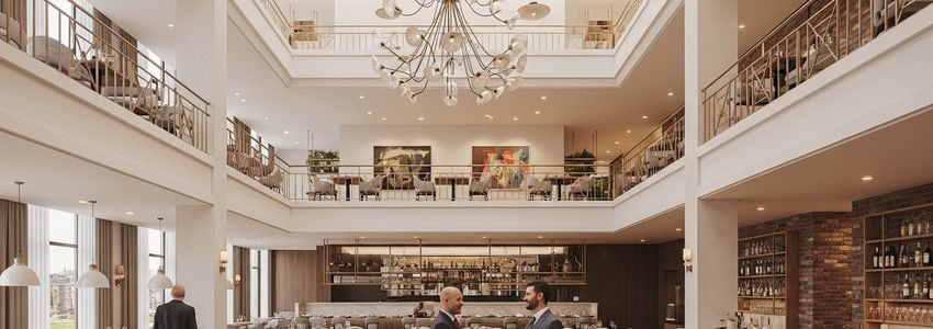 Franchise owner and business advisor reviewing financing agreement in a commercial restaurant setting