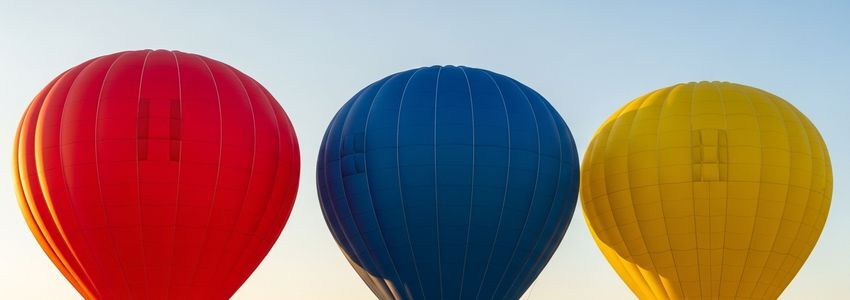 Hot air balloon ground crew preparing balloons for commercial flights
