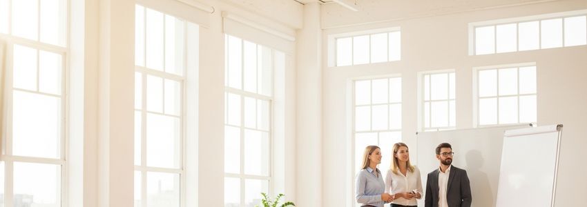 Business professionals reviewing credit reports and financial documents in a modern office