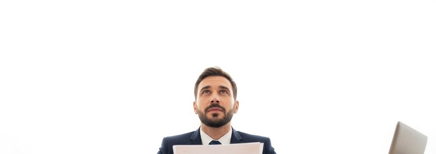 McAlister's Deli franchise financing - business owner reviewing loan documents