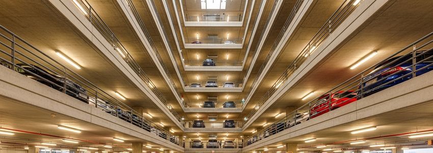 Commercial parking garage interior showing multiple levels of parking spaces, relevant to parking garage business loans and financing