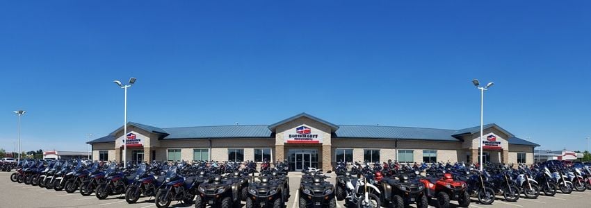 Powersports dealership showroom with motorcycles, ATVs and UTVs on display