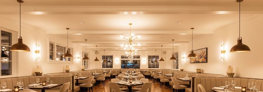 Restaurant owner reviewing renovation financing options with a business lender
