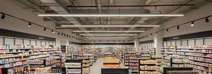 Well-organized retail store floor with professional layout and fully stocked product shelves