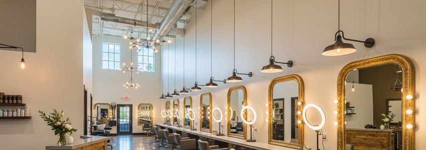 Modern renovated salon interior showcasing professional styling stations and elegant design - salon renovation financing results