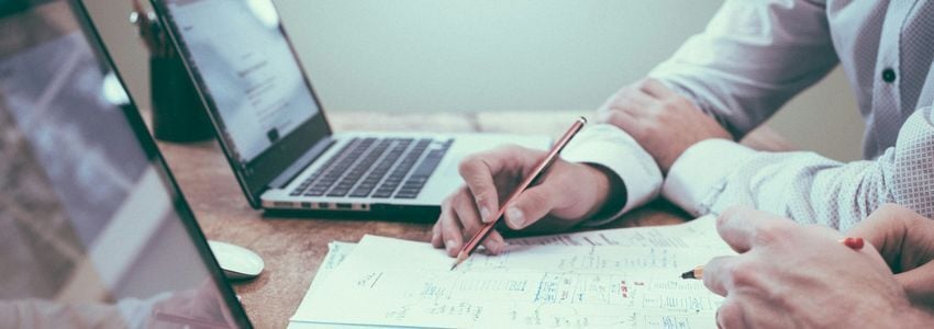 Business owner reviewing credit documents with a bank advisor