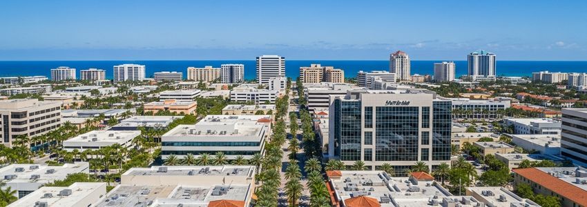 Business professionals reviewing small business loan options in West Palm Beach, Florida