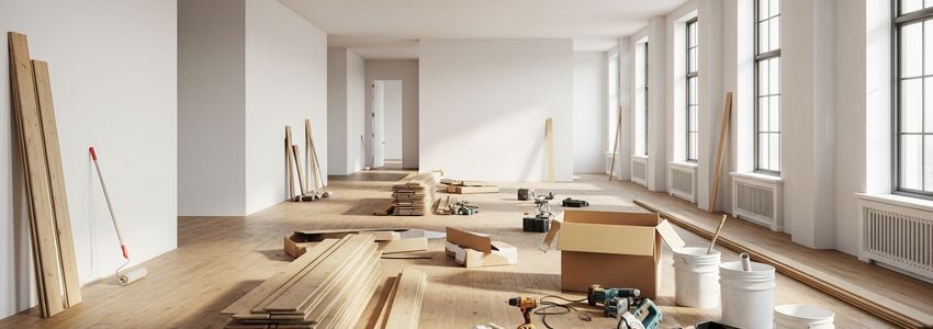 Commercial space interior under tenant improvement renovation with new flooring and fresh walls