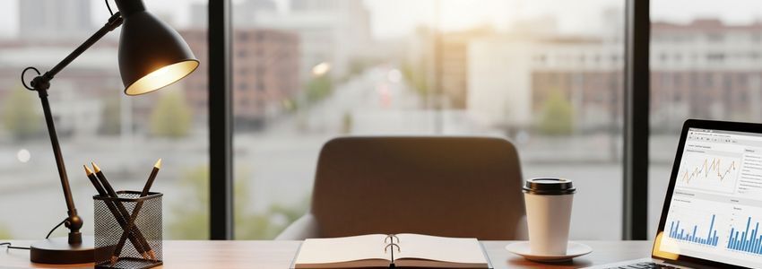Toledo Ohio business owner reviewing small business loan documents at modern office desk