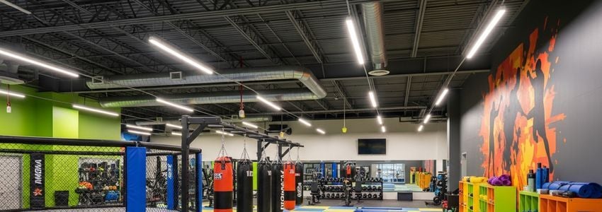 UFC GYM franchise interior with MMA training equipment