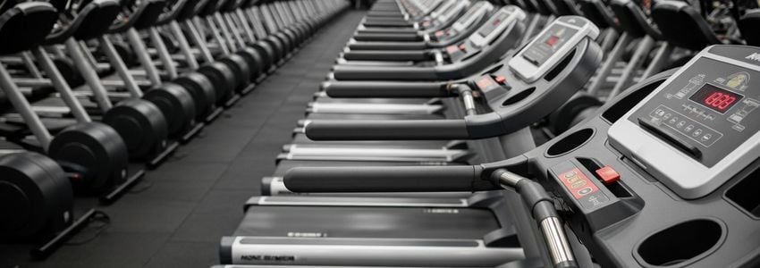 Workout Anytime franchise owner reviewing financing documents
