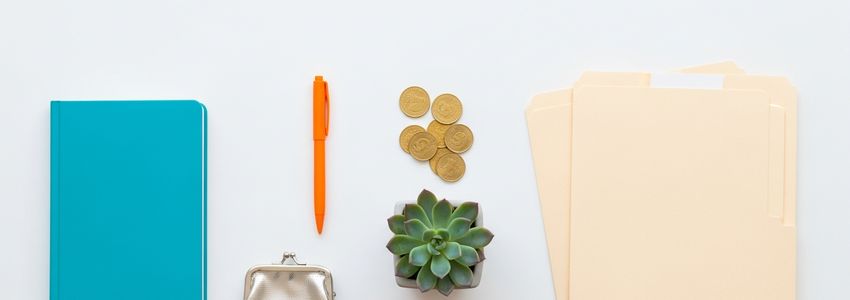Business owner reviewing bi-weekly loan payment schedule with financial documents
